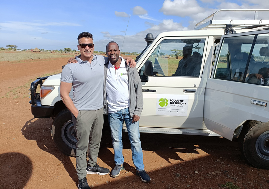 Dennis with Malvern Chikanya, Food for the Hungry county director, in Eastern Uganda during the implementation of Dennis’ capstone project bringing digital connectivity and digital education to remote schools.